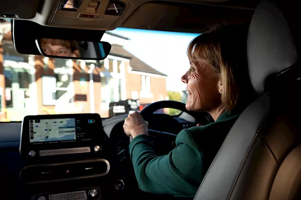 Woman driving EV